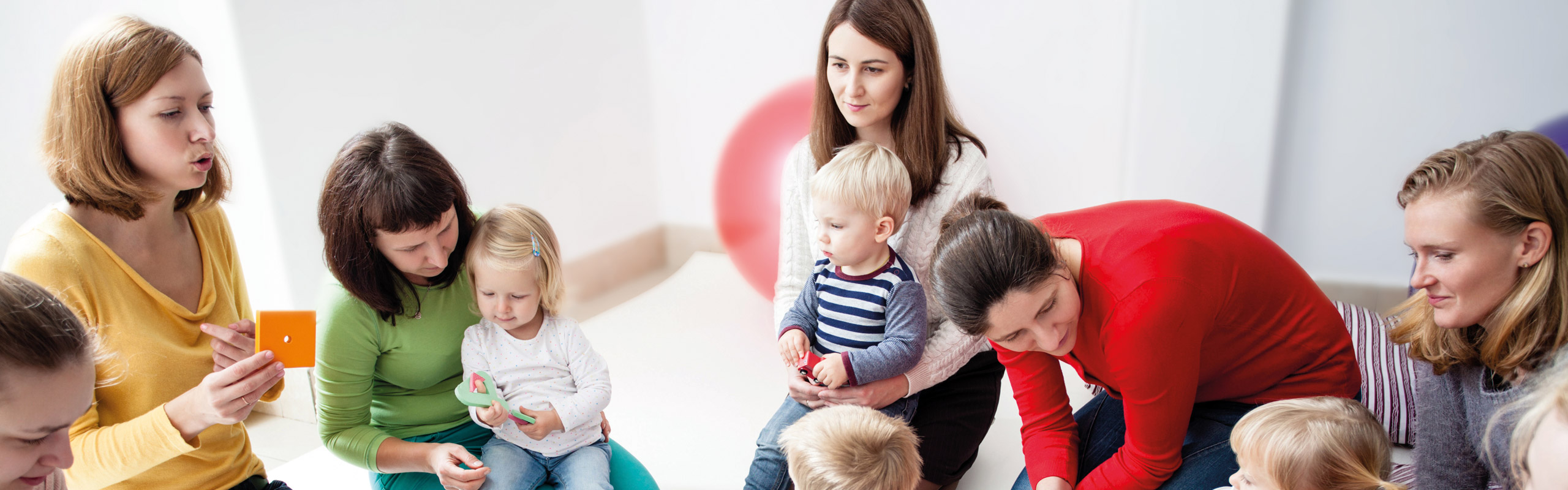 Young moms with their kids